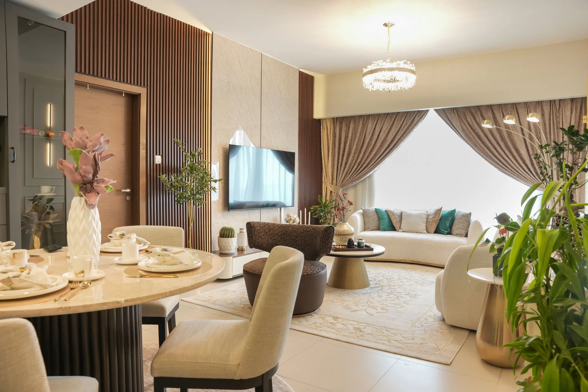 Dining space with fluted timber panels, pendant lights and bespoke finishes